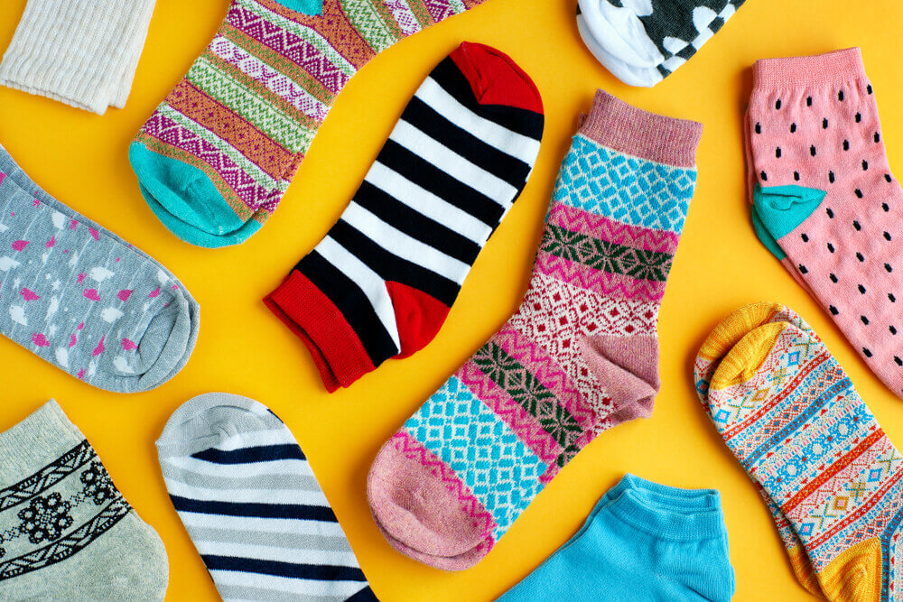 Different types of socks material and yellow background